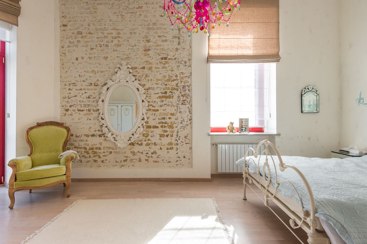 Shabby chic décor offers a nice contrast with the use of industrial furniture